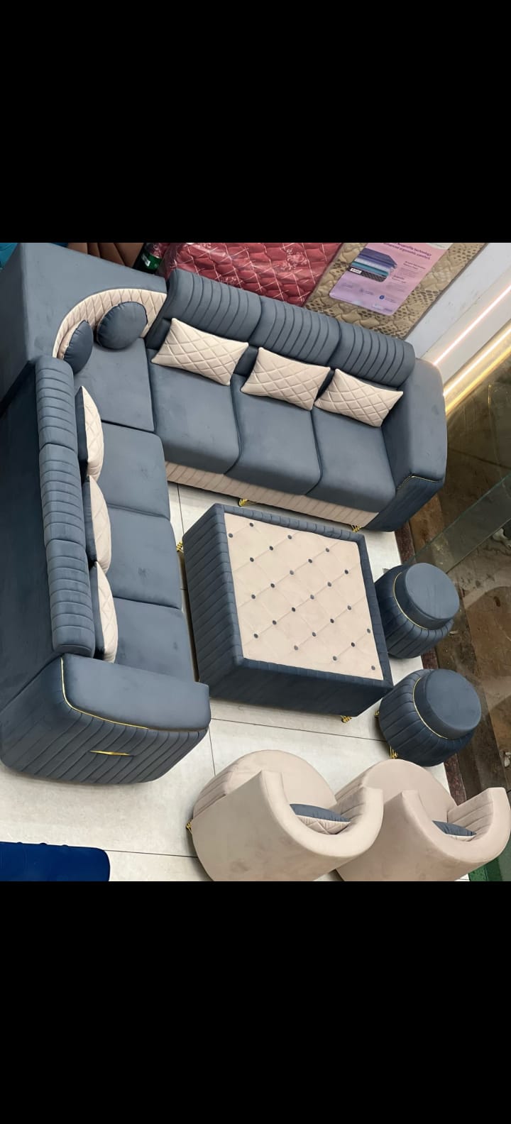 Ivory tufted wingback chairs with matching ottoman