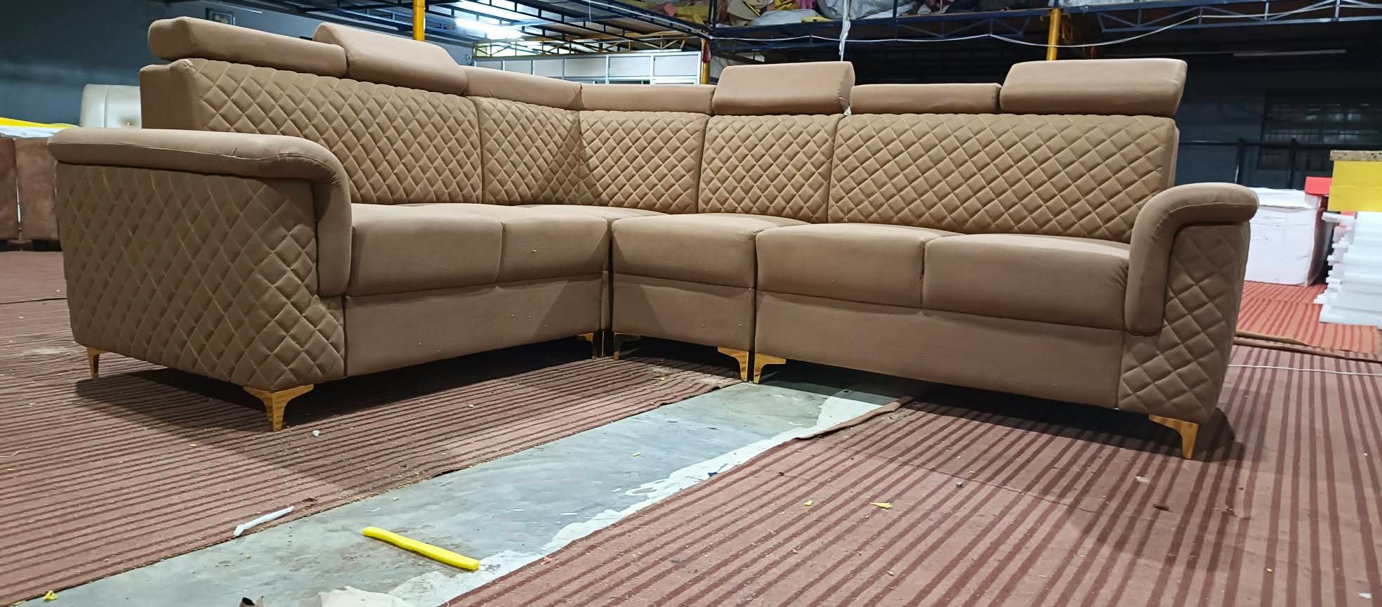 Beige quilted corner sofa set with gold legs