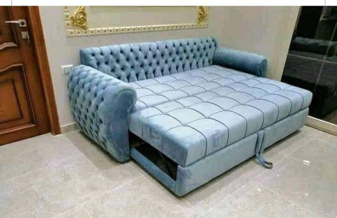 Sky blue tufted pull-out sofa bed