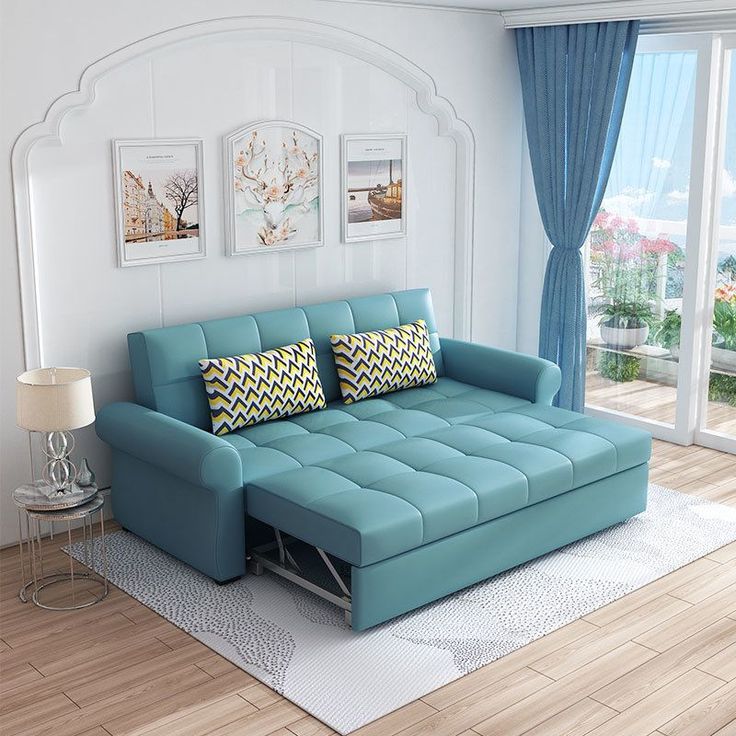 Turquoise pull-out sofa bed in a living room